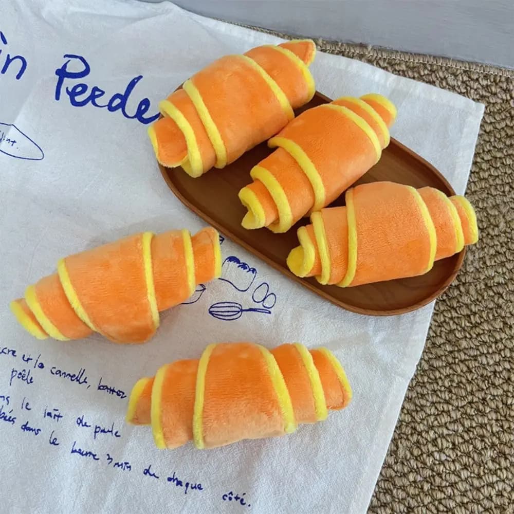 Brinquedo para cães em forma de croissant macio, para treino e estimulação mental, dispensador de petiscos, resistente a mordidas, comedouro lento para cães e cachorros.
